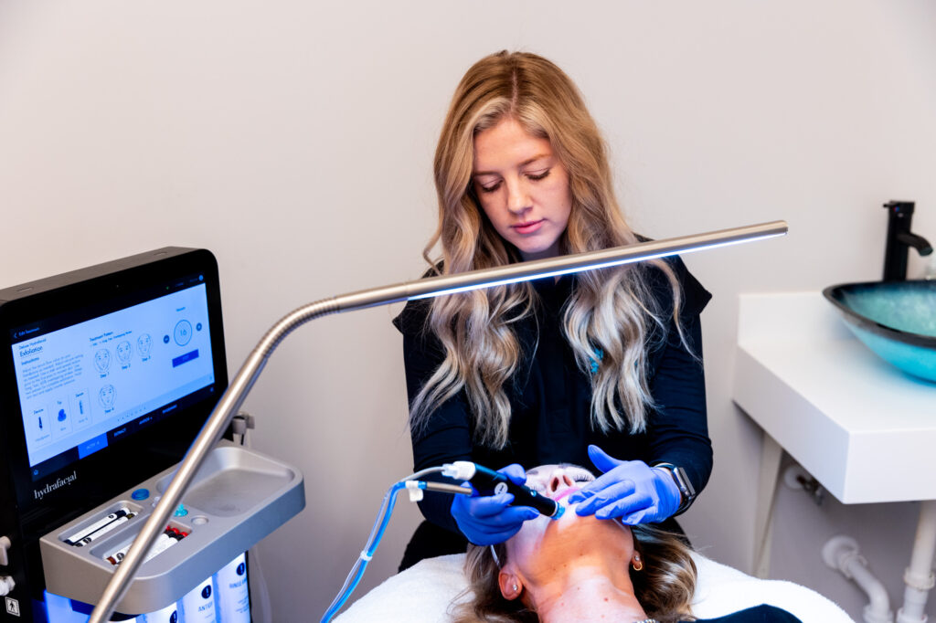 A Restoration MedSpa provider completes a Hydrafacial as a form of skin care in Greensboro.